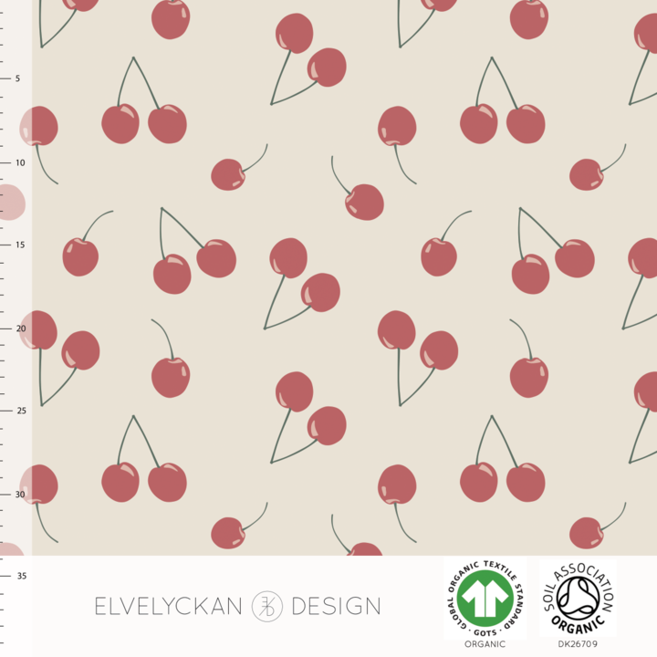 Cherries in creme organic cotton jersey knit fabric